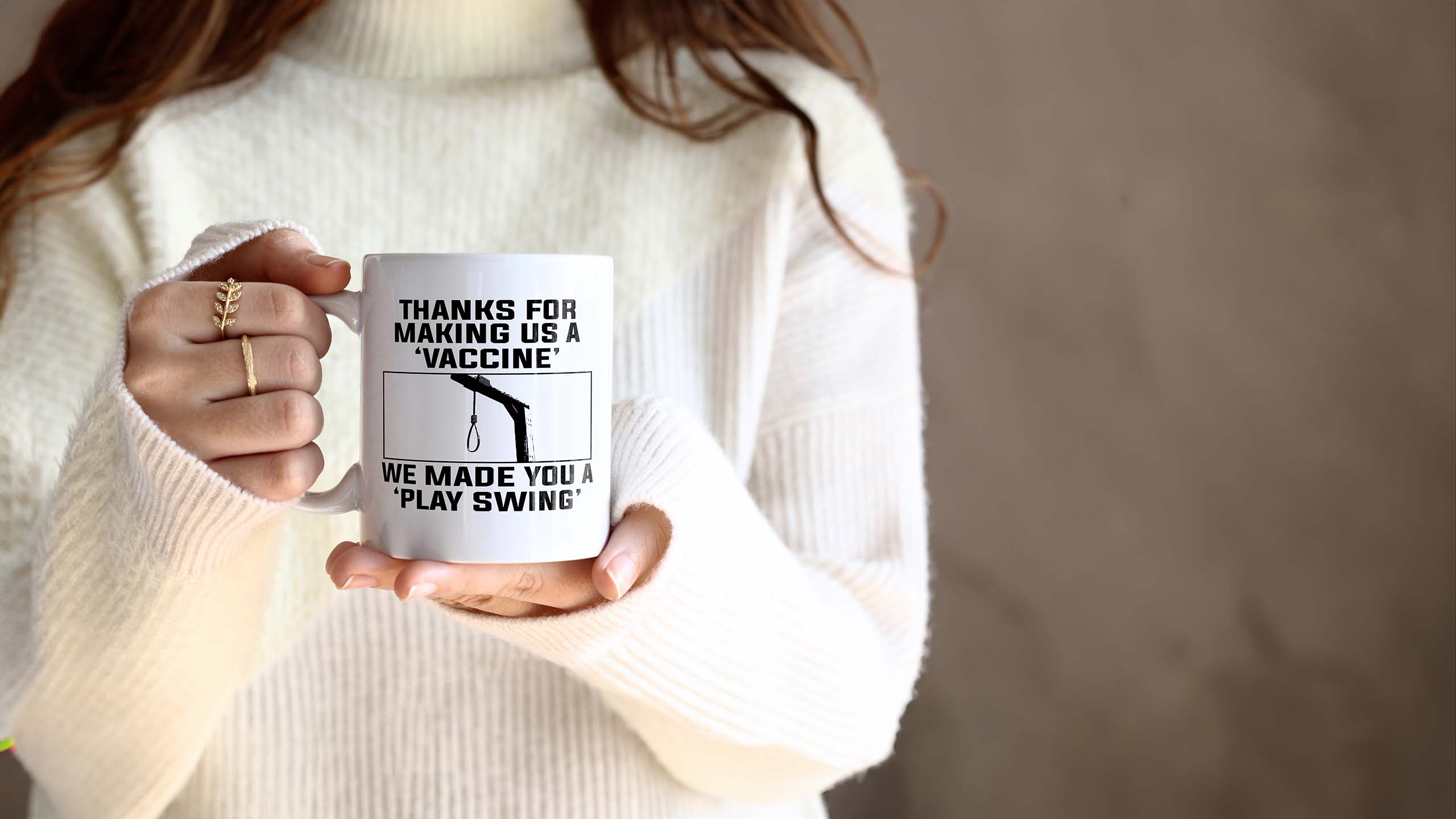 A woman holding a mug design from an OrwellianWear Freedom Offensive Membership